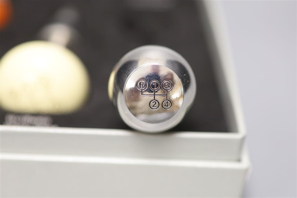 A cased novelty Mercedes Benz four-piece gear stick wine stopper set